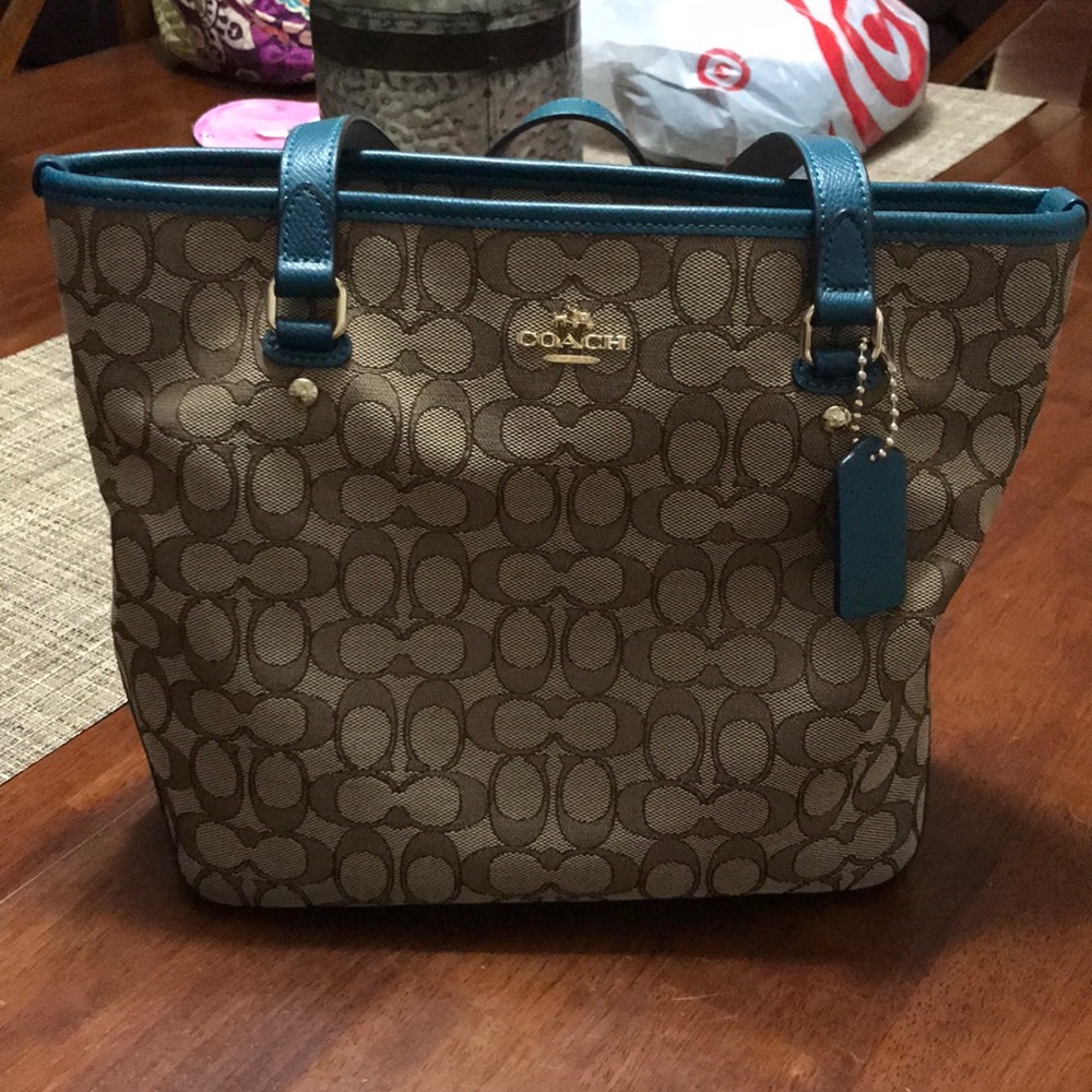 Tan and teal coach purse